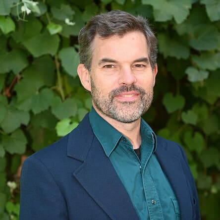 man with beard in blue suit