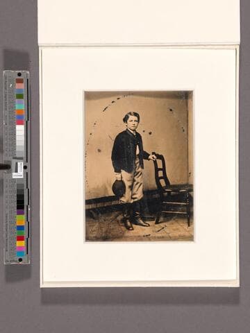 Portrait of a young boy wearing riding gear [Shorb family?]