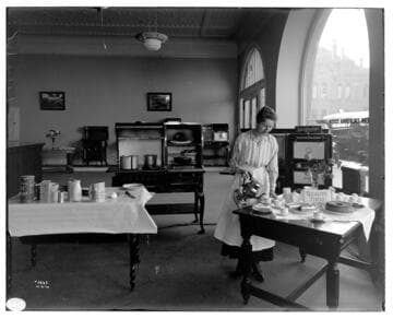 Miss Ebert conducting a cooking demonstration [with electric appliances] at Edison Redlands Service Center