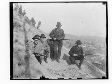 Los Angeles law enforcement officers holding rifles