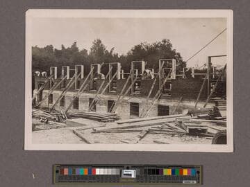 Huntington Library Construction: view showing west side of the East Wing brickwork and window frames, looking north