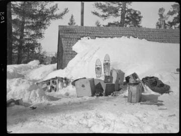 Snow gear outside survey cabin in the snow