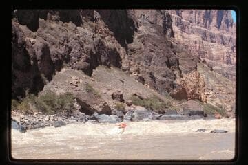 "Wee Red" climbs Vulcan Rapids