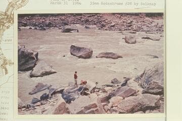 Dock Marston and Buzz Belknap check the Best and McDonald inscriptions at Rapid 16, Mile 204 1/2, Cataract Canyon