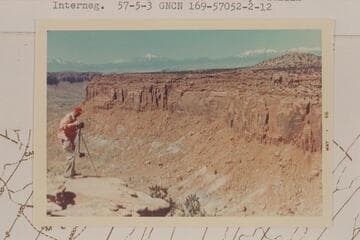 Mel Hurley at the top of South Trail.  Henry Mountains in distance