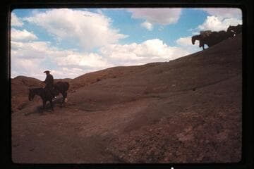 Down slick-rock to camp west Nasja Creek