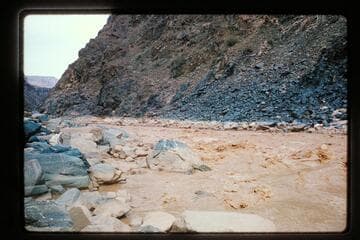 Down to un-named rapids from left bank side canyon, Mile 234.2