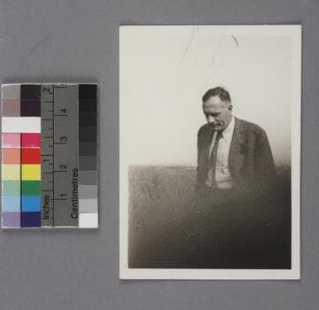 Edwin Powell Hubble, looking down while walking outside