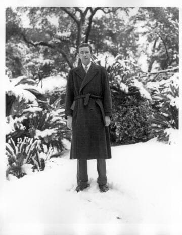 Frank Rinehart on the grounds after snowfall, January 11, 1949