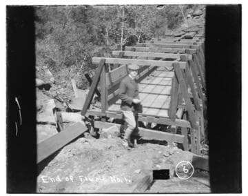 A person standing at the end of Flume #1 at Kaweah #2 Hydro Plant