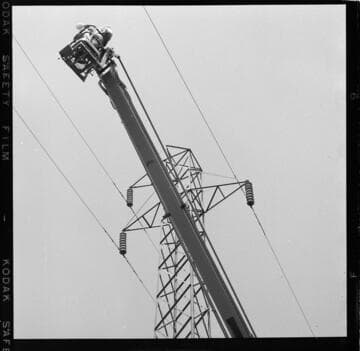 View from below of bucket rasing to wash tower insulators