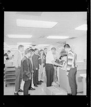 Boys (high school age) on a tour of Edison's data processing