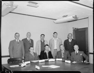 Posed photograph of  9 officers in Edison board room