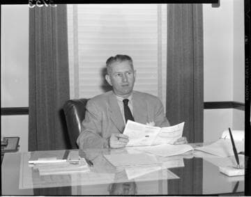 Man seated at desk