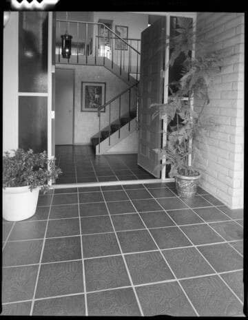 Entry way of a two story home with double doors