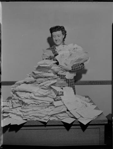 Envelope stack of "What I See Behind My Electric Bill" contest replies and Lillian Presnell