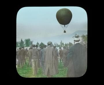 Spectators watch the American ascend