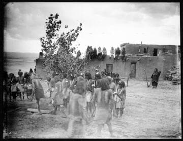 Snake Priest Circling in Front of Kisi (Kiva?). Hopi Snake Dance, ca. 1898