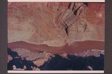 Approx. Mile 202.7 in Cataract Canyon.  Preliminary gauge:  29,700 cfs