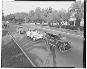 Parade of red white and blue Essex Coaches. 1924